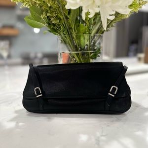 Black La regale satin evening bag with clear horseshoe shaped detail.